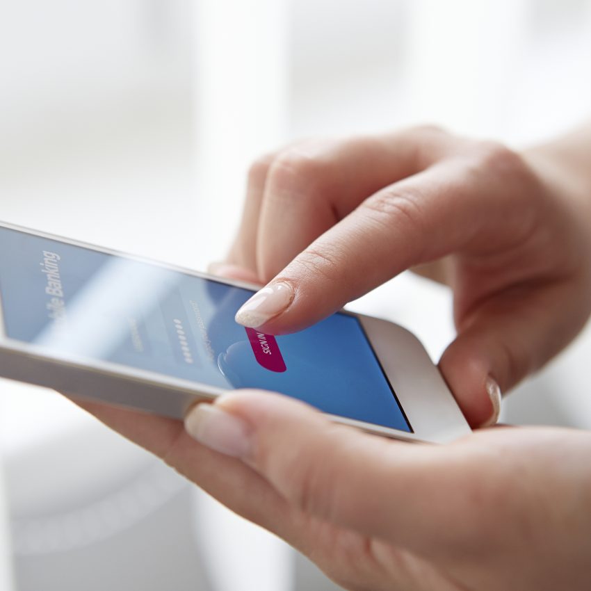 Female hands using mobile banking Female hands using mobile banking on smartphone
